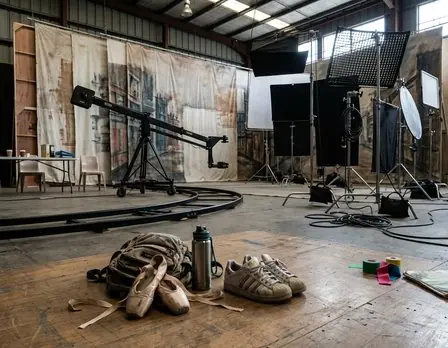 Dancers rehearsing under studio lights